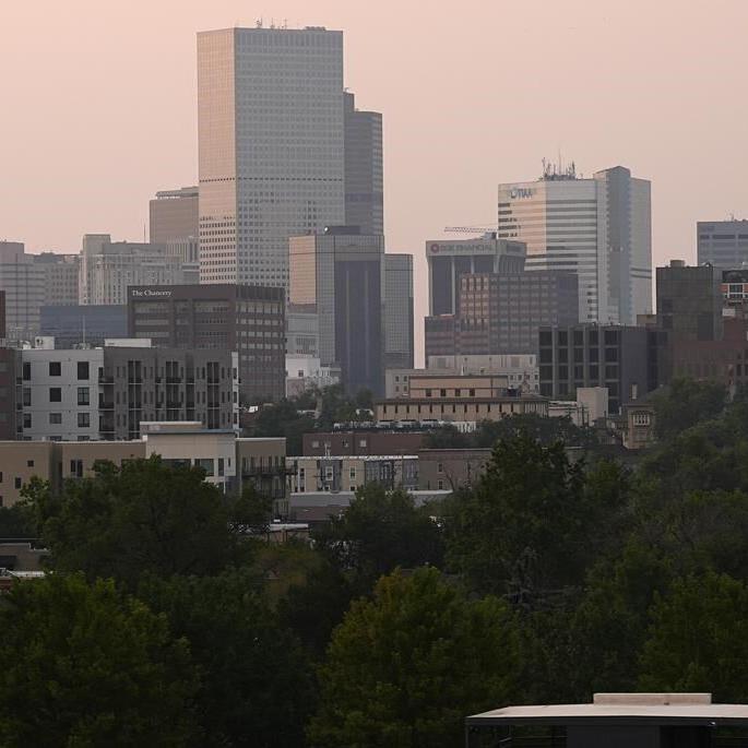 Lightning and a burning car pushed into a gully are blamed for wildfires scorching the West